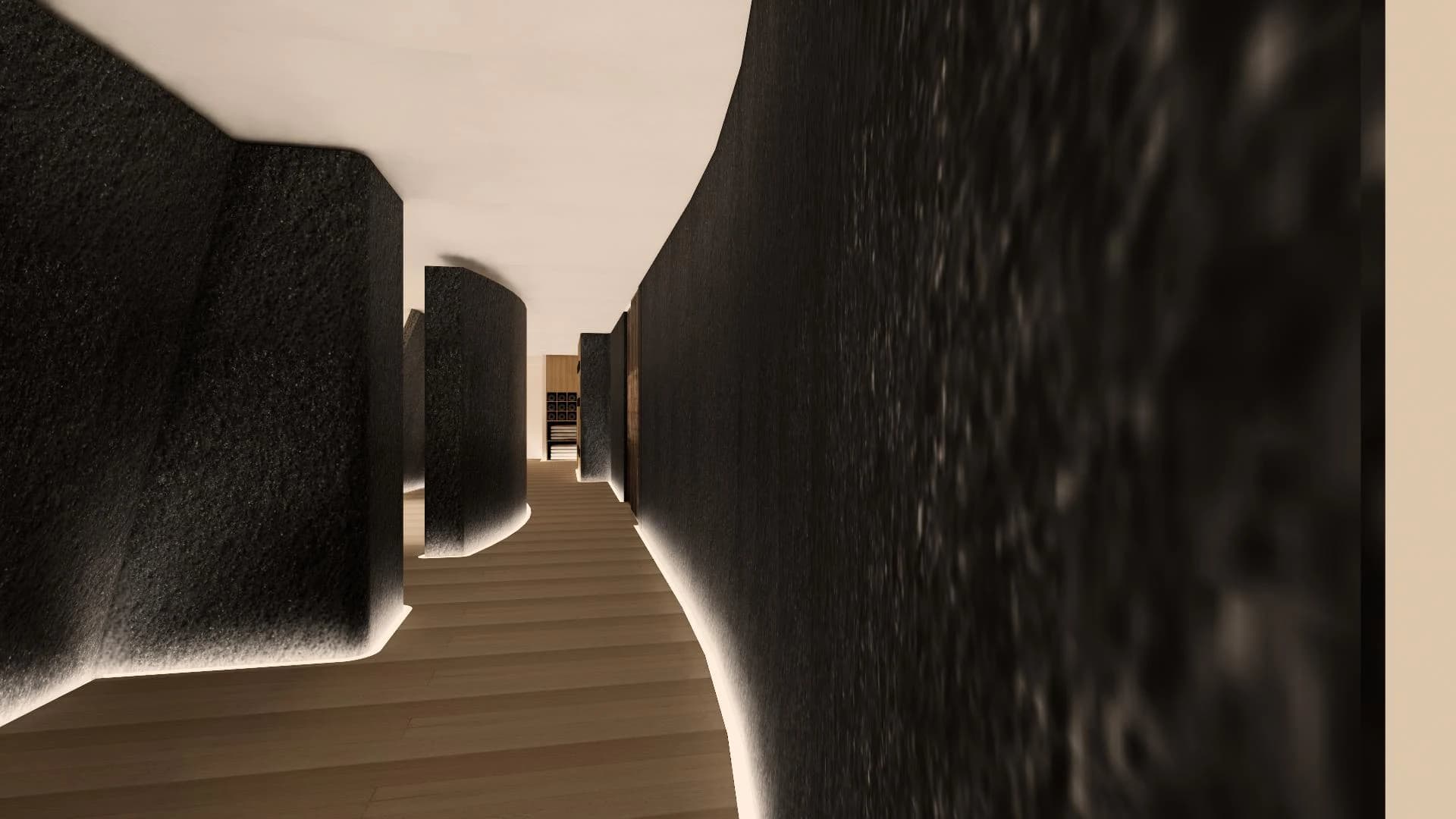 거친 돌 질감의 곡선 벽을 따라 이어지는 진입 복도